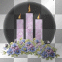 3 purple candles with flowers